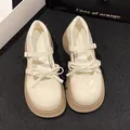 Elegante gebroken witte Mary Jane schoenen voor meisjes met dikke zool en strikdetail. - Beige