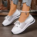 Close-up of white breathable knitted walking shoes for women with lightweight slip-on design - 36 / White