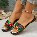 Detailed view of women's square-toe flat slippers with vibrant woven color-block straps - Black
