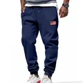 Detail of men's navy joggers featuring a small American flag patch on the thigh. - S / Bottoms / Navy Blue