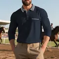 Dettaglio di una polo blu navy a maniche lunghe con colletto a contrasto grigio - Blu Notte