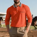 Dettaglio ravvicinato della polo arancione a maniche lunghe con tasca e colletto grigio - Arancione