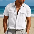 Close-up of men's white linen short sleeve shirt featuring double utility chest pockets - S / Tops / White
