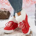 Fashionable red winter snow boots for women featuring white faux fur trim and platform soles - Red