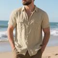 Casual men's short-sleeved linen shirt with dual pockets shown on a sunny beach - S / Tops / Khaki