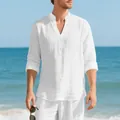 Breathable white linen Henley shirt for men styled in a relaxing beach setting - S / Tops / White