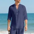 Relaxed navy blue linen Henley shirt for men shown in a sunny beach environment detail - S / Tops / Navy Blue