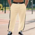 Close-up of men's heavy fleece joggers featuring stylish black side stripes and drawcord - Khaki