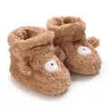 Vista detallada de botas de invierno para bebé suaves y esponjosas con cara de dibujo - Marrón