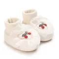 Macro detail of soft white baby sock shoes with lace trim and red cherry embroidery - White