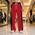 Detailed view of red and black color block men's casual heavyweight straight-leg sweatpants - S / Bottoms / Red/Black