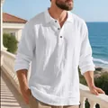 Detail of white linen textured polo shirt worn by a model in a seaside setting - S / Tops / White