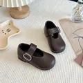Elegant dark brown Mary Jane leather shoes for girls featuring a stylish silver buckle strap. - Brown