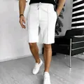 Close-up of men's white waffle texture summer shorts featuring a comfortable drawstring waist. - S / Bottom (DK100) / White