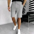 Detailed view of men's grey waffle knit shorts styled for a casual summer look - S / Bottom (DK100) / Gray