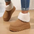 Detailed view of women's camel snow boots with white fur collar and thick platform sole. - Brown