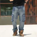 Relaxed fit men's cargo jeans in light blue denim featuring multiple utility pockets - 30 / Bottoms / Light Blue