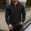 Close-up view of a men's black waffle textured stand collar casual long sleeve shirt - S / Tops / Black
