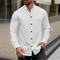 Detailed view of white men's waffle knit long sleeve shirt with stand collar and pocket - White