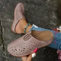 Detailed view of women's hollow-out floral mules featuring a 4.5cm chunky platform heel - 36 / Pink