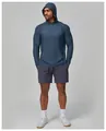 Detailed macro view showing the textured blue fabric and half-zip of men's fitness hoodie - S / Tops / Blue Pattern