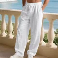 Detail of men's white loose linen trousers with pleated knee design and drawstring waist - S / Bottoms / White