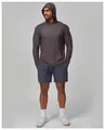 Male model wearing grey long-sleeve hooded fitness top and blue athletic shorts - S / Tops / Purple Grey