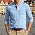Detailed view of a light blue long-sleeved men's Henley shirt with a chest pocket - M / Tops / Light Blue