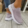 Close-up view of breathable mauve flyknit slip-on sneakers for women on a natural wooden deck - 36 / Light Purple