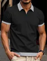 Detail of men's black waffle knit polo shirt with grey contrast collar and zipper. - S / Tops / Black