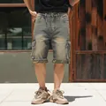 Men's loose fit denim cargo shorts with a distressed wash and camouflage hem detail - 30 / Retro Yellow