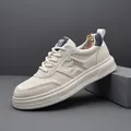 Baskets en cuir blanc pour hommes avec détails gaufrés et semelle légère élégante - 38 / Blanc