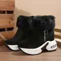 Detail view of black women's winter boots with thick white soles and cozy faux fur trim. - 35 / Black