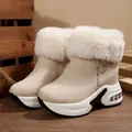 Detailed side view of beige platform snow boots with white faux fur collar and side zipper - 35 / Beige