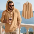 Detailed view of apricot men's linen hooded henley shirt with premium textured fabric. - Earthy Yellow