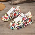 Vibrant graffiti print platform sneakers with thick white soles and lace-up front. - 36 / Painted Letter Print Style (632) / Red