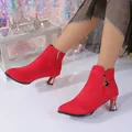 Detailed view of red suede pointed toe ankle boots with kitten heels on a model - 35 / Single Lining / Red