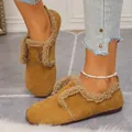 Close-up of retro fleece-lined warm loafers on feet - 36 / Brown
