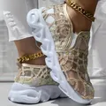 Detail view of breathable gold mesh slip-on platform sneakers for women with wavy soles. - 37 / Gold