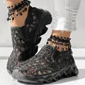 Close-up of black breathable mesh platform sneakers with sequined hollow-out details - Black
