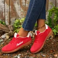 Close-up detail of vibrant red vintage style German Army Trainers with white accents - 35 / Red