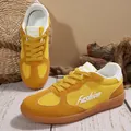 Close-up of yellow vintage German Army Trainer sneakers with mesh and suede details. - 35 / Yellow