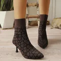 Macro view of brown and black geometric patterned pointed toe elastic fabric sock boots - 36 / Tan