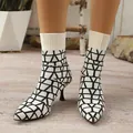 Elegant pointed-toe stretch knit ankle boots with a stylish geometric pattern and slim heels. - 36 / Off White