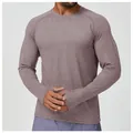 Close-up of men's quick-dry sports long sleeve shirt with functional thumb holes detail. - S / Tops / Dusty Pink