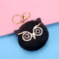 Elegant black owl fluffy ball keychain featuring golden glitter eye details for bag charm - Owl Style (2-10) / Black