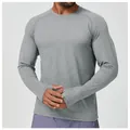 Detailed shot of men's grey quick-dry athletic long sleeve shirt with thumbhole cuffs - S / Tops / Light Grey