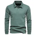 Detailed macro view of a sage green long sleeve polo shirt with embroidered collar - Grass Green