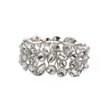 Detailed close-up of a vintage wide silver stretch bracelet with leaf crystal patterns - White