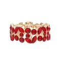 Close-up detail of vintage gold bracelet with faceted red leaf-shaped crystals - Red